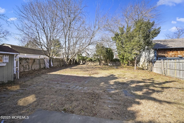 view of yard with a fenced backyard