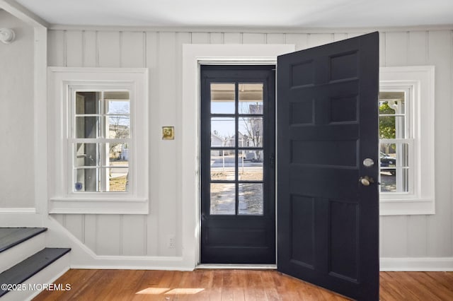 foyer featuring wood finished floors and a healthy amount of sunlight