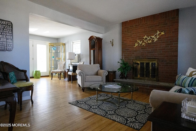 living room featuring a fireplace and wood finished floors