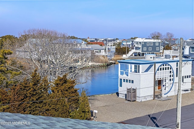 exterior space with a water view and a residential view