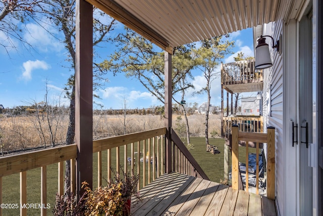 deck featuring a yard