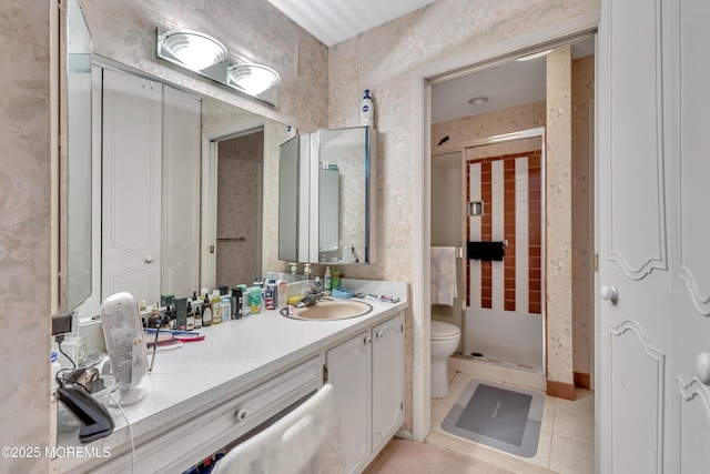 full bath featuring vanity, a shower stall, toilet, and tile patterned floors