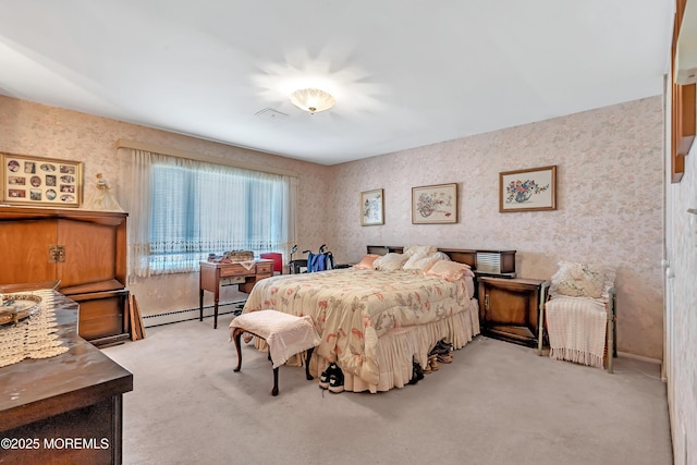 bedroom with baseboard heating, carpet, visible vents, and wallpapered walls