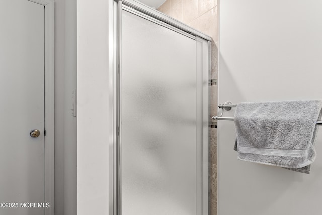 full bathroom with a shower stall