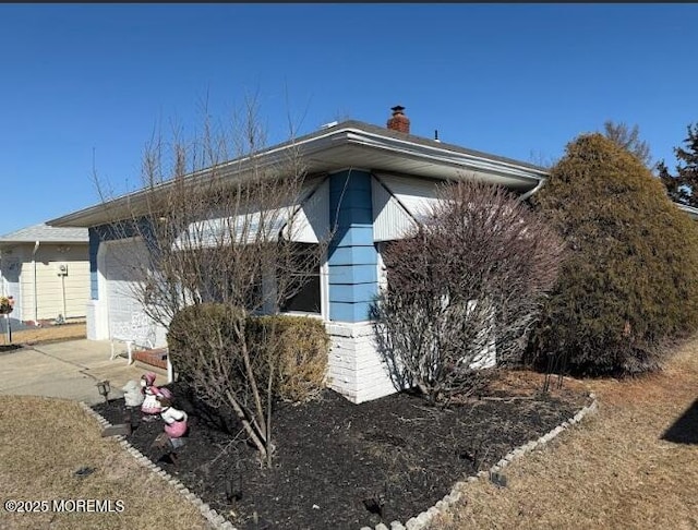 view of home's exterior featuring a chimney