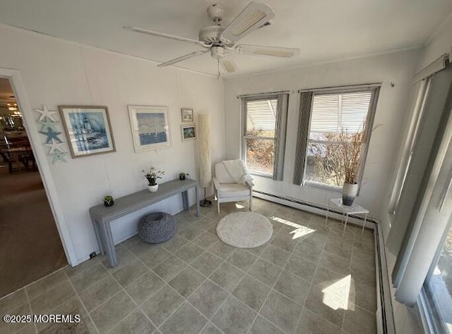 unfurnished room with a baseboard heating unit, a ceiling fan, and tile patterned floors