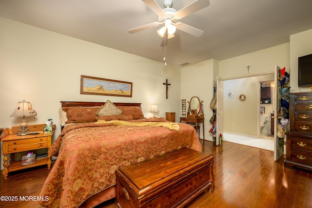 bedroom featuring a ceiling fan, visible vents, and hardwood / wood-style flooring