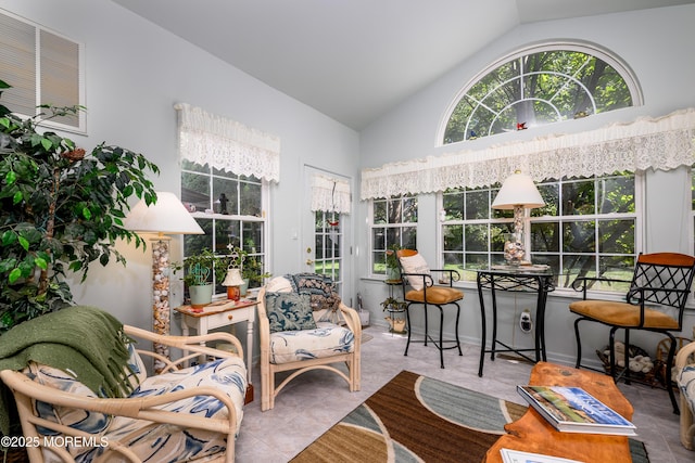 sunroom / solarium featuring vaulted ceiling