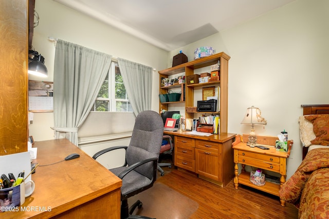 office space with dark wood-type flooring