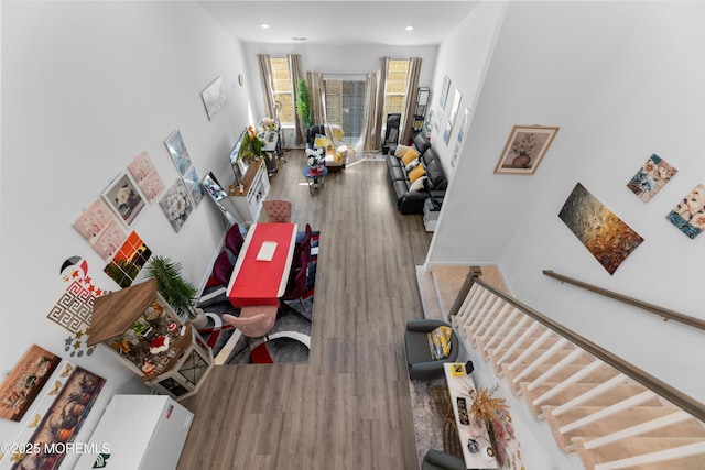 interior space featuring stairs, recessed lighting, and wood finished floors