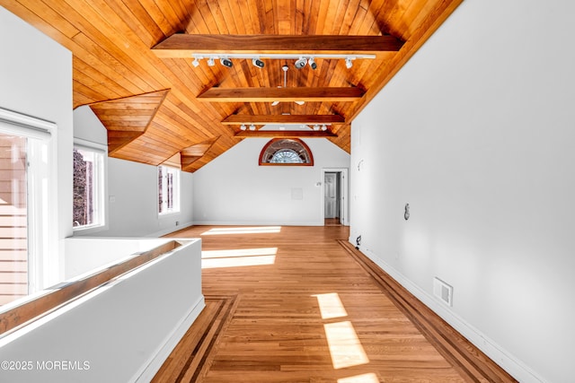 hall with visible vents, lofted ceiling with beams, wood ceiling, light wood-style flooring, and track lighting