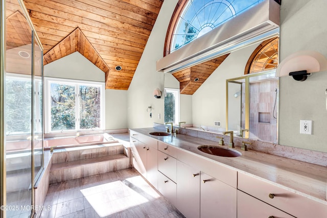 full bathroom featuring a garden tub, double vanity, a sink, and wood ceiling