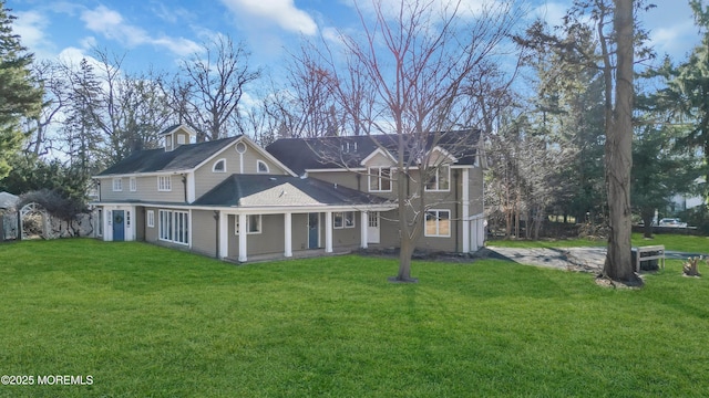 view of front of property with a front yard and driveway