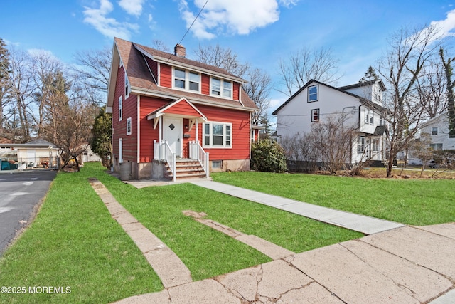 bungalow-style house with a shingled roof, a chimney, and a front yard