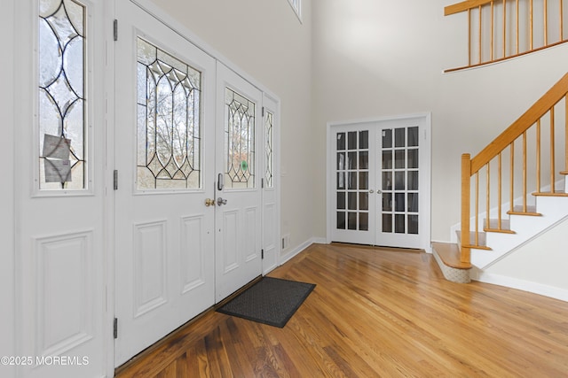 1759 Todd Rd, Toms River, NJ 08755 - entrance foyer with french doors, wood finished floors, stairway, baseboards, and a towering ceiling