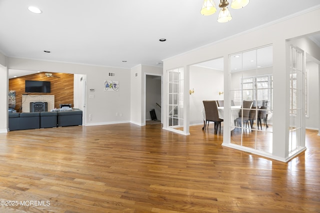 1759 Todd Rd, Toms River, NJ 08755 - unfurnished living room featuring crown molding, baseboards, light wood finished floors, recessed lighting, and wood walls
