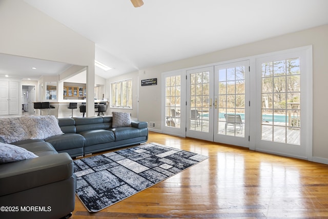 1759 Todd Rd, Toms River, NJ 08755 - living area featuring wood finished floors, lofted ceiling, and baseboards