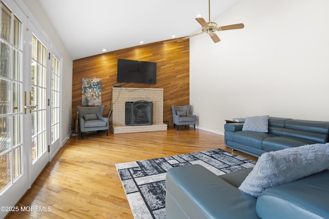 1759 Todd Rd, Toms River, NJ 08755 - living room with wood walls, recessed lighting, a fireplace, a ceiling fan, and baseboards
