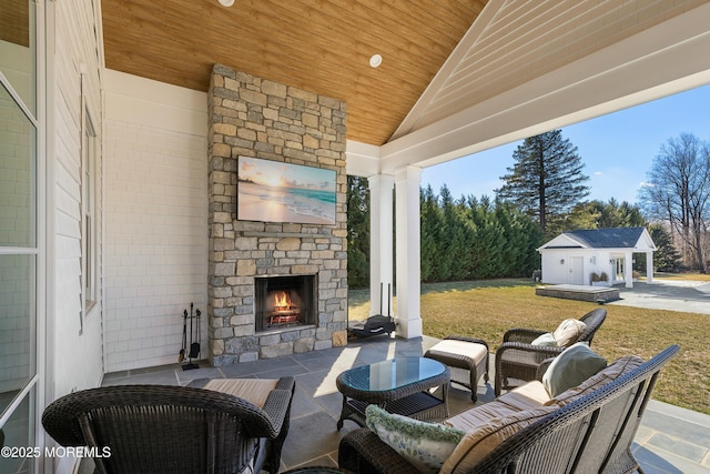 view of patio / terrace with an outdoor stone fireplace