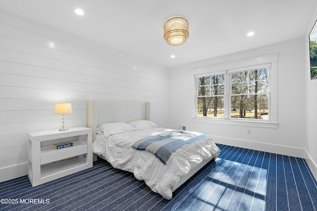 bedroom with dark carpet, recessed lighting, and baseboards