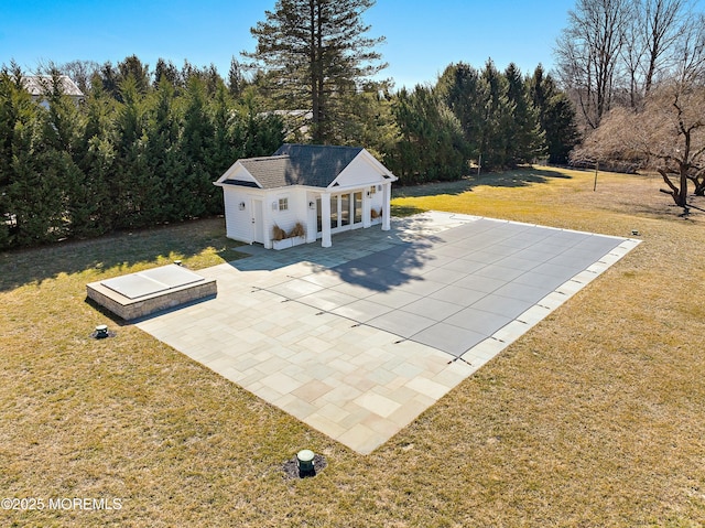 view of patio with an outbuilding and a storage structure