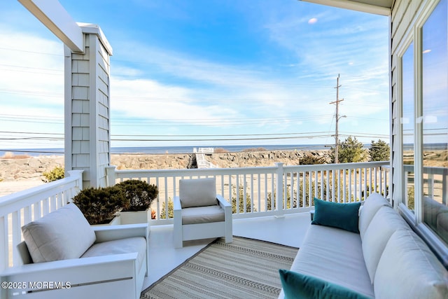 wooden deck featuring outdoor lounge area