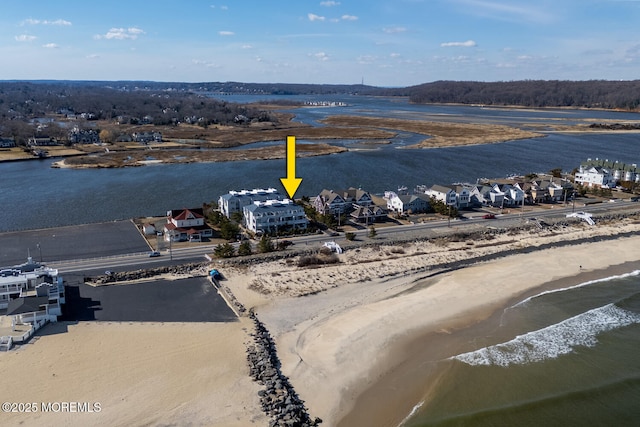 drone / aerial view with a water view