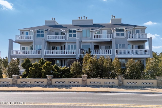 view of building exterior with fence