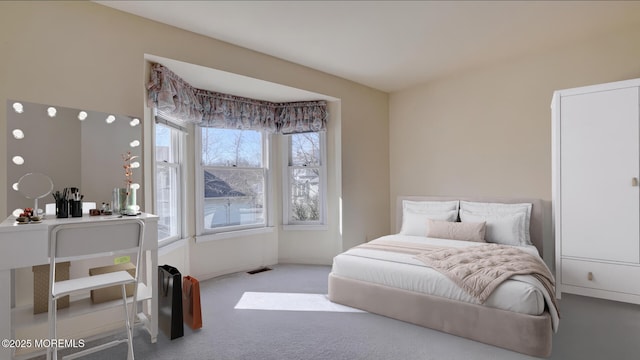 bedroom featuring carpet and visible vents