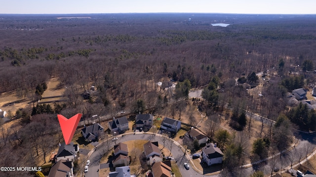 bird's eye view featuring a view of trees