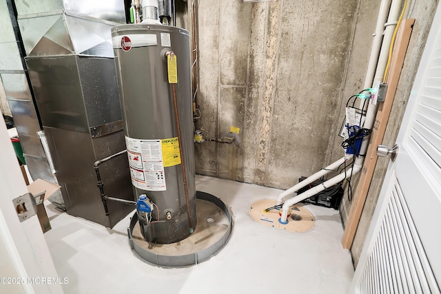 utility room featuring gas water heater