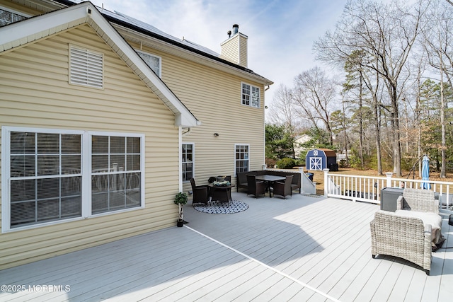 deck featuring an outdoor structure