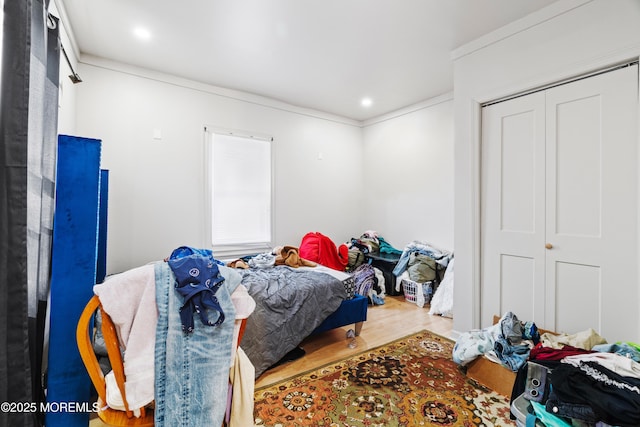 bedroom featuring wood finished floors and recessed lighting