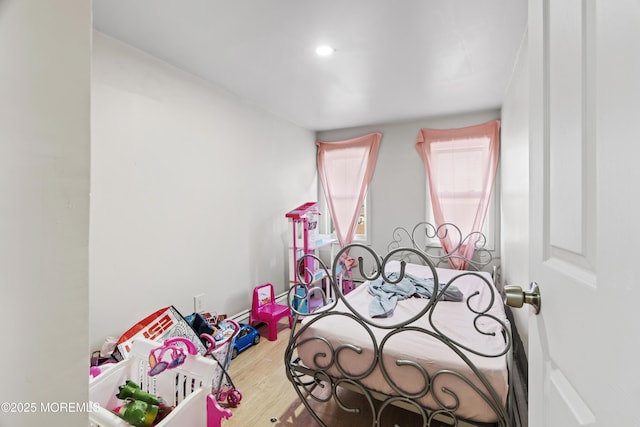 bedroom featuring wood finished floors