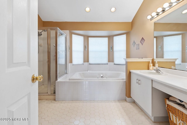 bathroom featuring a garden tub, tile patterned flooring, vanity, and a stall shower