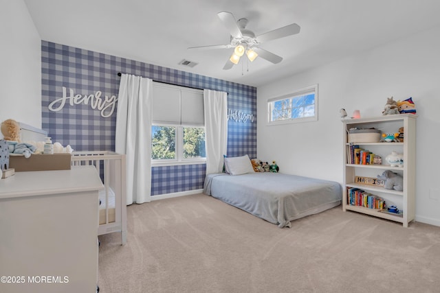 bedroom with baseboards, carpet, visible vents, and wallpapered walls