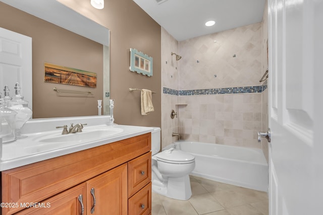 bathroom with washtub / shower combination, tile patterned flooring, vanity, and toilet