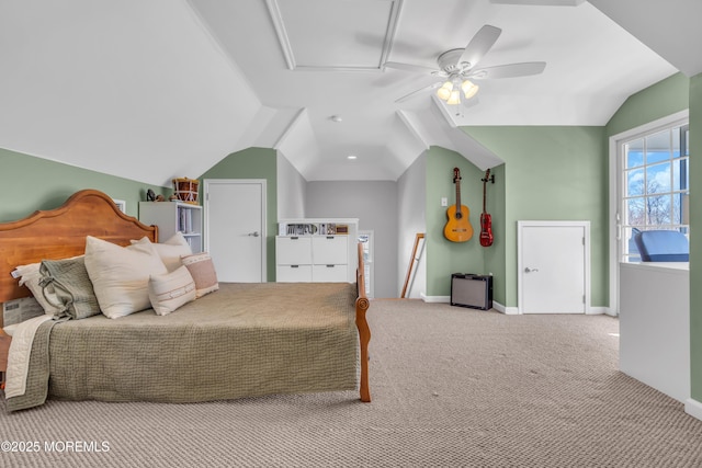 carpeted bedroom with lofted ceiling, baseboards, and a ceiling fan