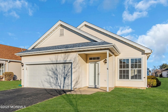 view of front facade featuring a garage, aphalt driveway, a front lawn, and roof with shingles