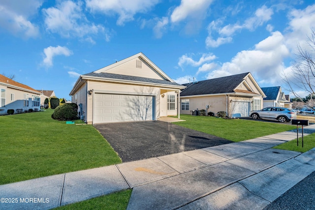 ranch-style house featuring a garage, aphalt driveway, a front lawn, and a shingled roof