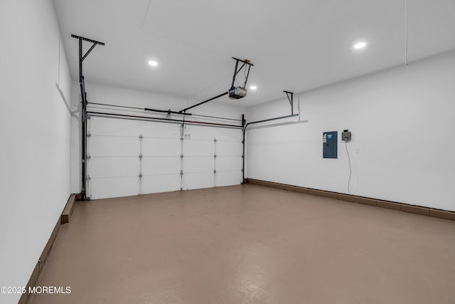 garage with electric panel, baseboards, and a garage door opener