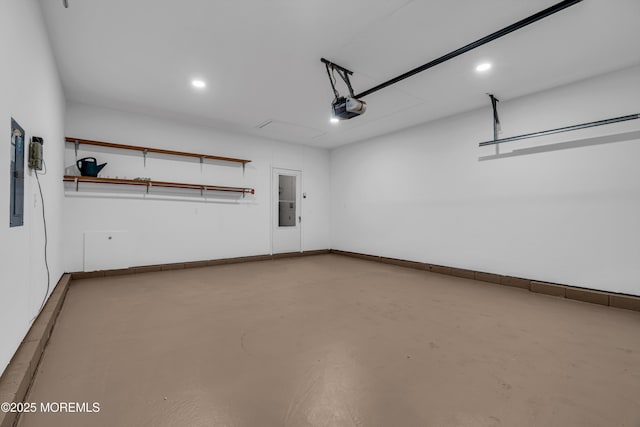 garage with electric panel, baseboards, and a garage door opener