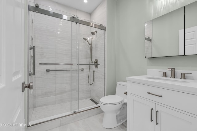 full bath with toilet, a stall shower, and vanity