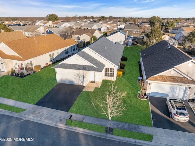 birds eye view of property with a residential view