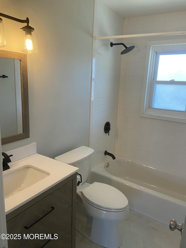 full bath featuring toilet, marble finish floor, shower / washtub combination, and vanity