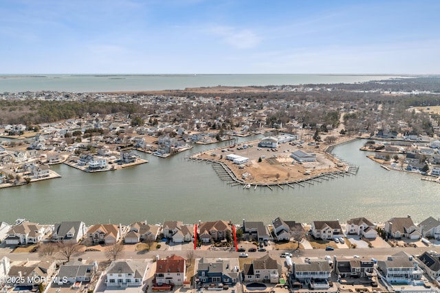 bird's eye view with a residential view and a water view