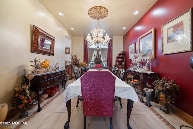 tiled dining space featuring recessed lighting and a chandelier