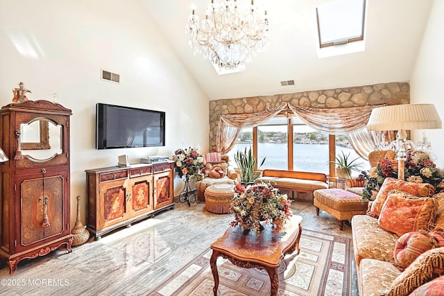 living area with high vaulted ceiling, visible vents, and a chandelier