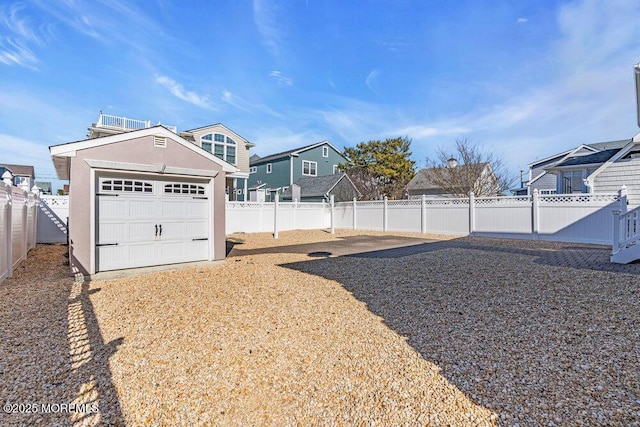 view of yard with an outbuilding and a fenced backyard