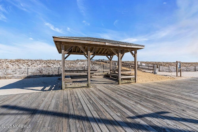 dock area featuring a gazebo and fence